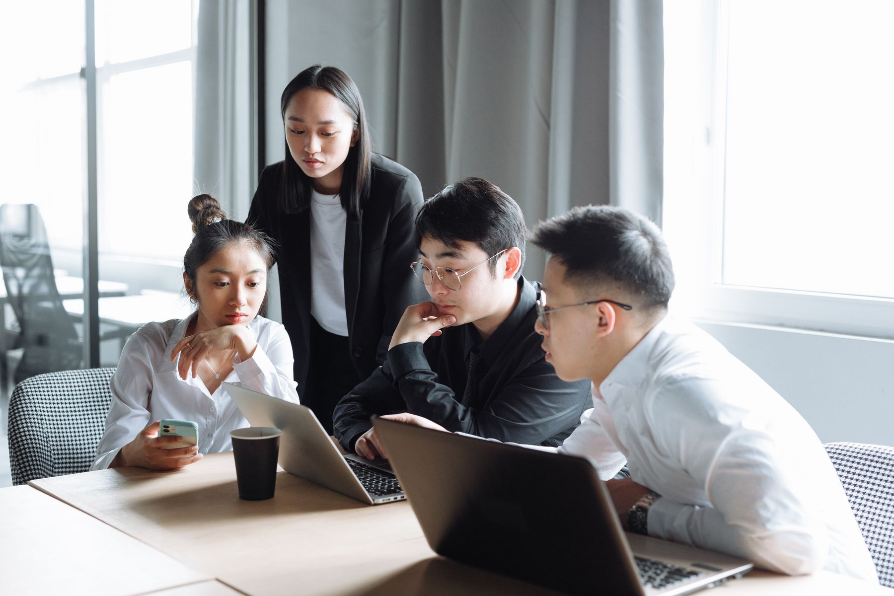 Professionals collaborating around a table